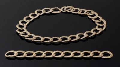 Lot 468 - A 9ct gold necklace and bracelet, of textured...