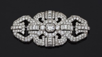 Lot 472 - A diamond brooch of buckle shape, the central...