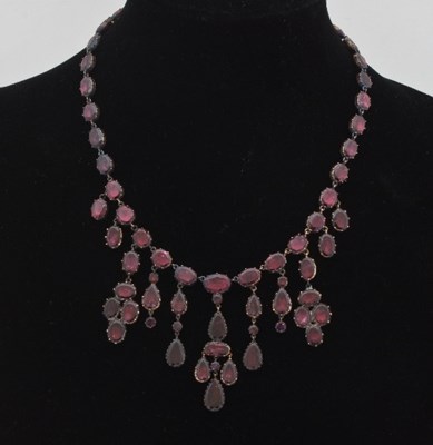 Lot 474 - A Victorian foiled garnet fringe necklace in...