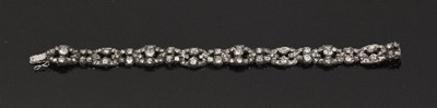 Lot 475 - A diamond bracelet of pierced links, the...