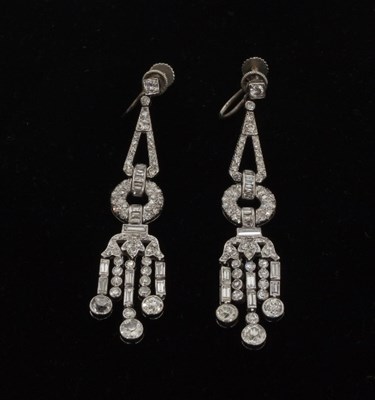 Lot 477 - A pair of diamond ear pendants of stylised...