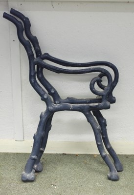 Lot 500 - A pair of iron garden bench ends, painted...