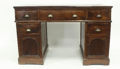 Lot 553 - A walnut pedestal writing desk, with three...