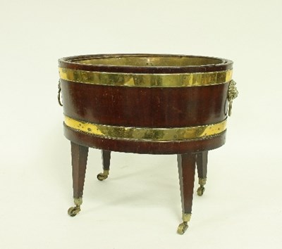 Lot 556 - A George III mahogany and brass bound wine...