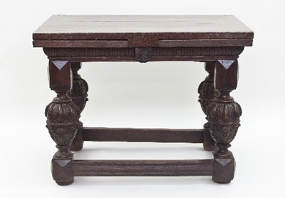 Lot 569 - An early 17th Dutch oak withdraw centre table,...