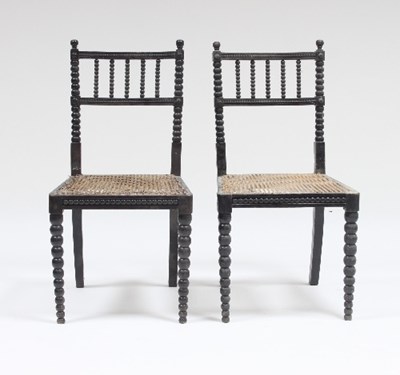 Lot 585 - A pair of ebonised bobbin turned occasional...