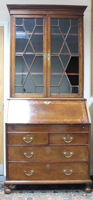 Lot 588 - An oak bureau bookcase, the associated...