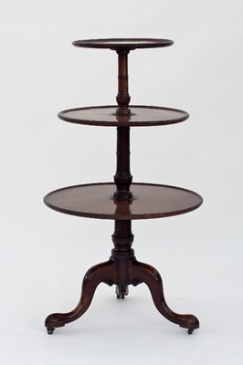 Lot 599 - A George III mahogany three-tier dumb waiter,...