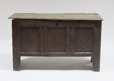 Lot 605 - A 17th Century oak chest with plank lid and...