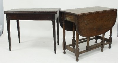 Lot 632 - An oak tea table of rectangular form on square...