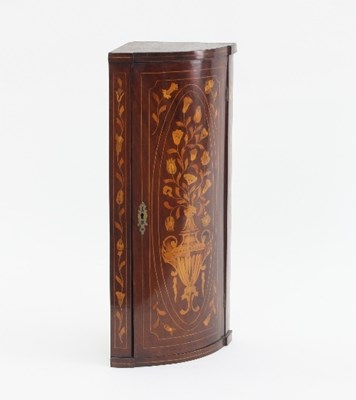 Lot 642 - A Dutch marquetry bow-fronted corner cupboard,...