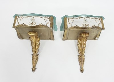 Lot 643 - A pair of 20th Century mirrored console tables...