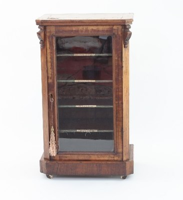 Lot 648 - A Victorian walnut music cabinet, with glass...