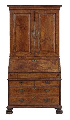 Lot 655 - A Queen Anne walnut bureau bookcase, circa...