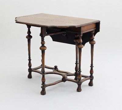 Lot 662 - A walnut gateleg table in the William and Mary...