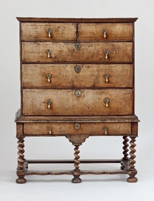 Lot 666 - A Queen Anne walnut chest on stand, circa 1710,...