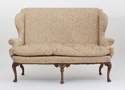 Lot 669 - A Queen Anne style walnut settee with high...