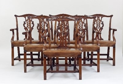 Lot 677 - A mahogany dining suite of Chippendale style,...