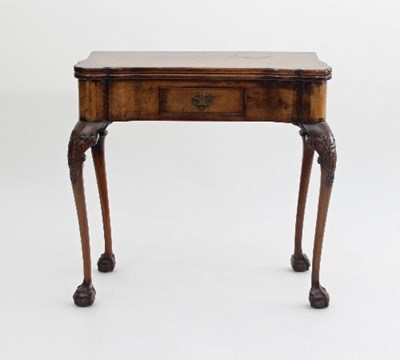 Lot 689 - A George II style walnut card table by...