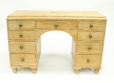 Lot 708 - A pine kneehole pedestal desk, 115cm wide