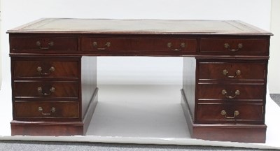 Lot 717 - A mahogany partners' desk, the top with inset...