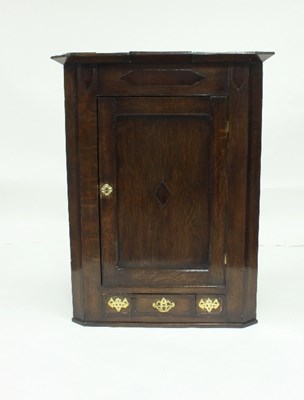 Lot 728 - An oak corner cupboard fitted adjustable...