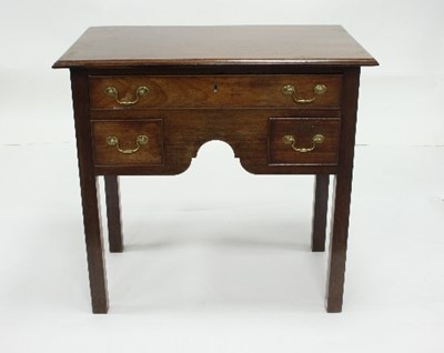 Lot 733 - An early 19th Century fruitwood kneehole table,...