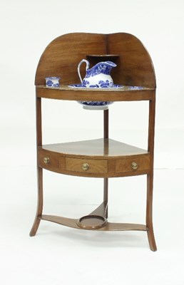 Lot 735 - A Georgian mahogany corner washstand with...