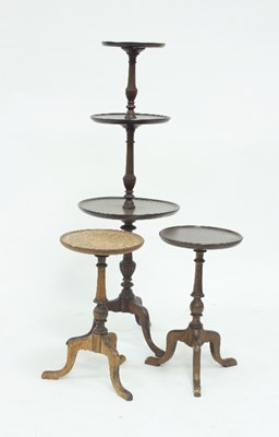 Lot 753 - A mahogany three-tier whatnot on a turned...