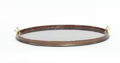 Lot 769 - An Edwardian mahogany tray with brass handles...