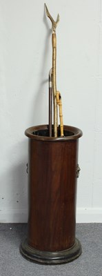 Lot 779 - A mahogany umbrella stand of cylinder form,...