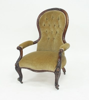 Lot 782 - A Victorian carved walnut framed open armchair...