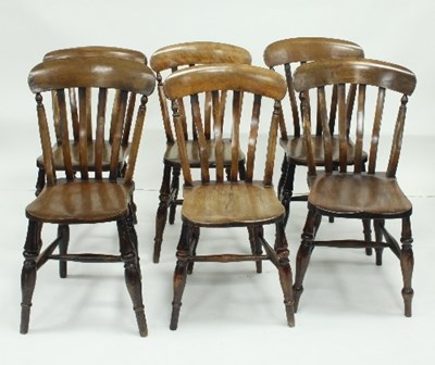 Lot 785 - A set of six country chairs with shaped seats,...