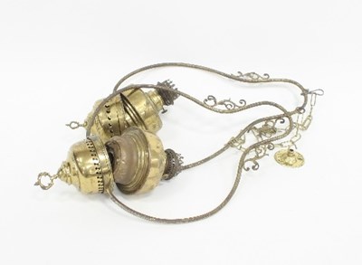 Lot 789 - Two hanging brass oil lamps, converted to...