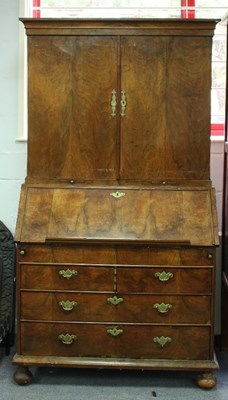 Lot 796 - A walnut bureau bookcase, 18th Century and...