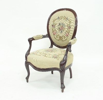 Lot 799 - A Victorian style open armchair, the carved...