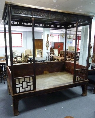 Lot 807 - A large Oriental day bed, with panelled canopy...