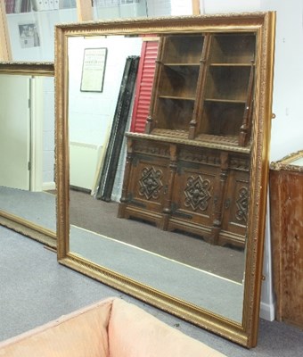 Lot 824 - A large wall mirror with concave gilt frame,...