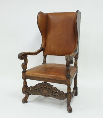 Lot 827 - A 17th Century style wing armchair,...