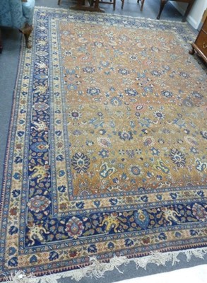 Lot 851 - A large Persian carpet, palmettes on a pale...