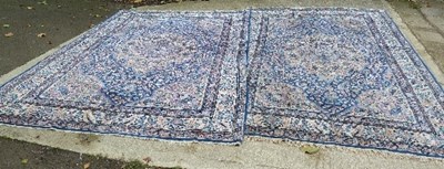 Lot 859 - A pair of large Tabriz rugs with central...