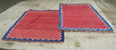 Lot 861 - A near pair of kilim type rugs, the tomato...