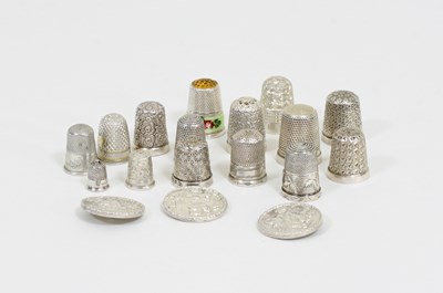 Lot 10 - A collection of silver thimbles, one with band...