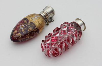 Lot 27 - A red glass scent bottle, highlighted in gilt...