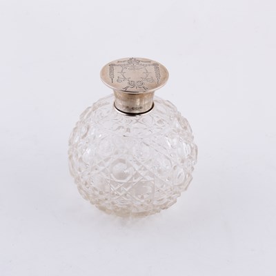 Lot 78 - An Edwardian spherical cut glass scent bottle,...