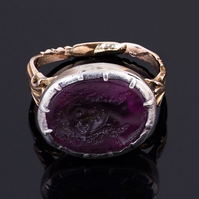 Lot 103 - An 18th Century purple glass intaglio ring...