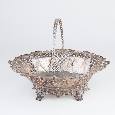 Lot 169 - An early George III silver swing-handled cake...