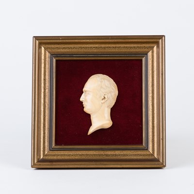 Lot 241 - An ivory relief bust of a gentleman facing...