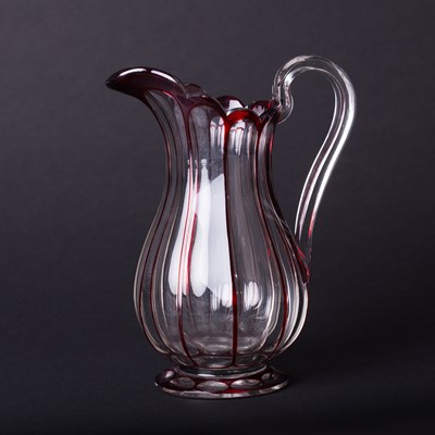 Lot 295 - A late 19th Century pear shaped glass jug with...