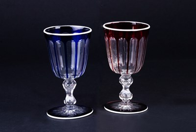 Lot 323 - A pair of glasses with faceted bowls one blue,...